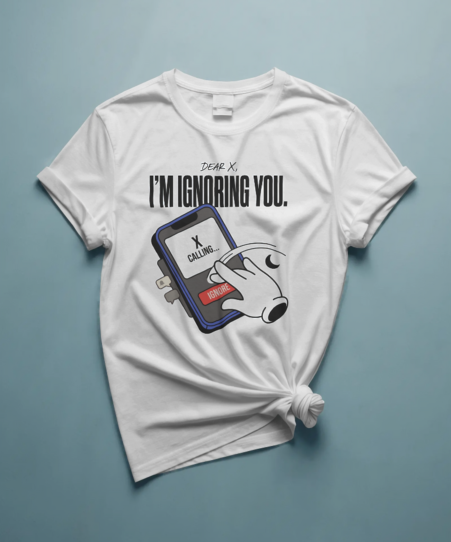 White unisex graphic t-shirt featuring the text "DEAR X, I'M IGNORING YOU." The design includes a creative illustration of a smartphone with an incoming call from "X", and a vintage cartoon gloved hand pressing the red ignore button. Premium savage streetwear by The Nite Stream.