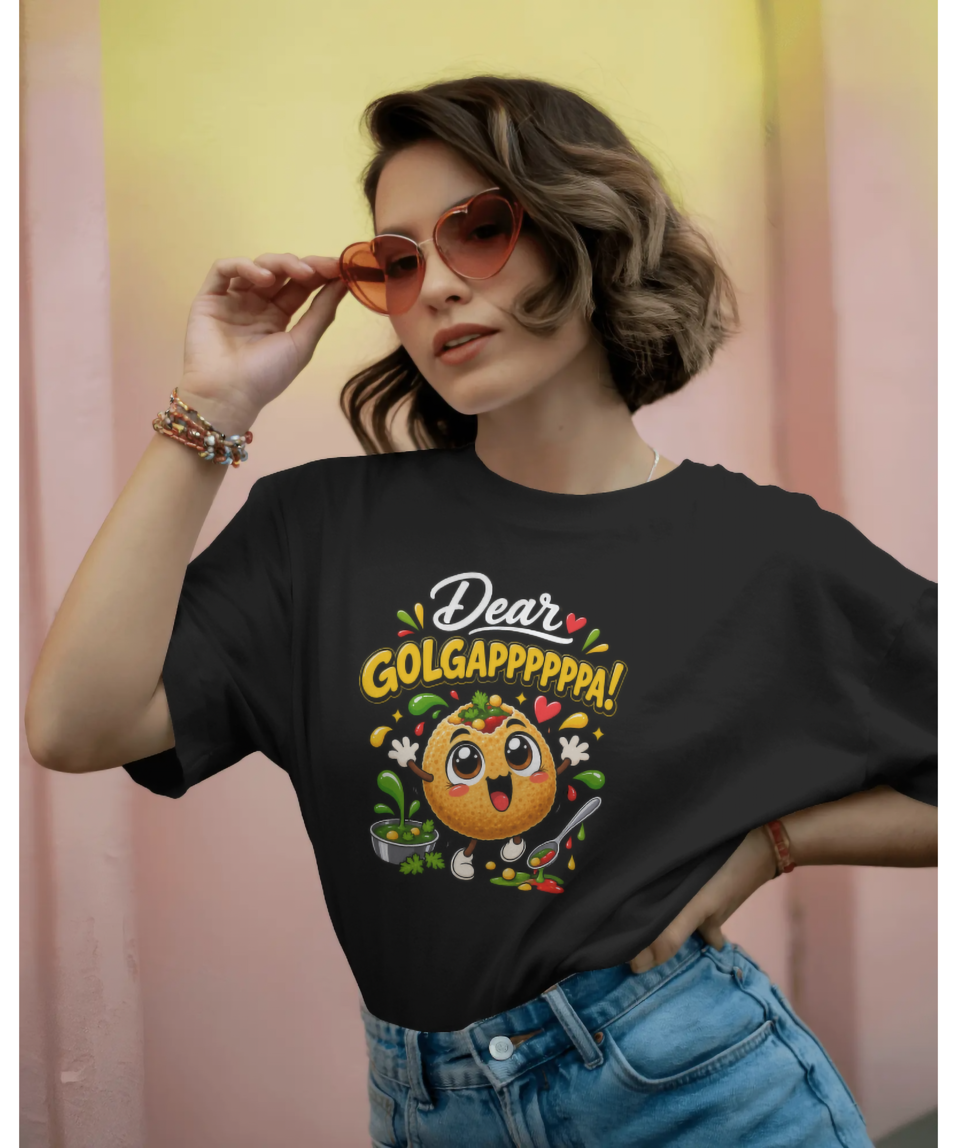 Female model wearing Nite Stream black unisex t-shirt featuring a cute 3D animated Golgappa character with the text Dear GOLGAPPPPPA!