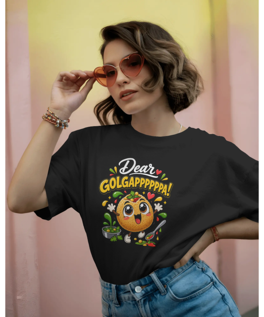Female model wearing Nite Stream black unisex t-shirt featuring a cute 3D animated Golgappa character with the text Dear GOLGAPPPPPA!