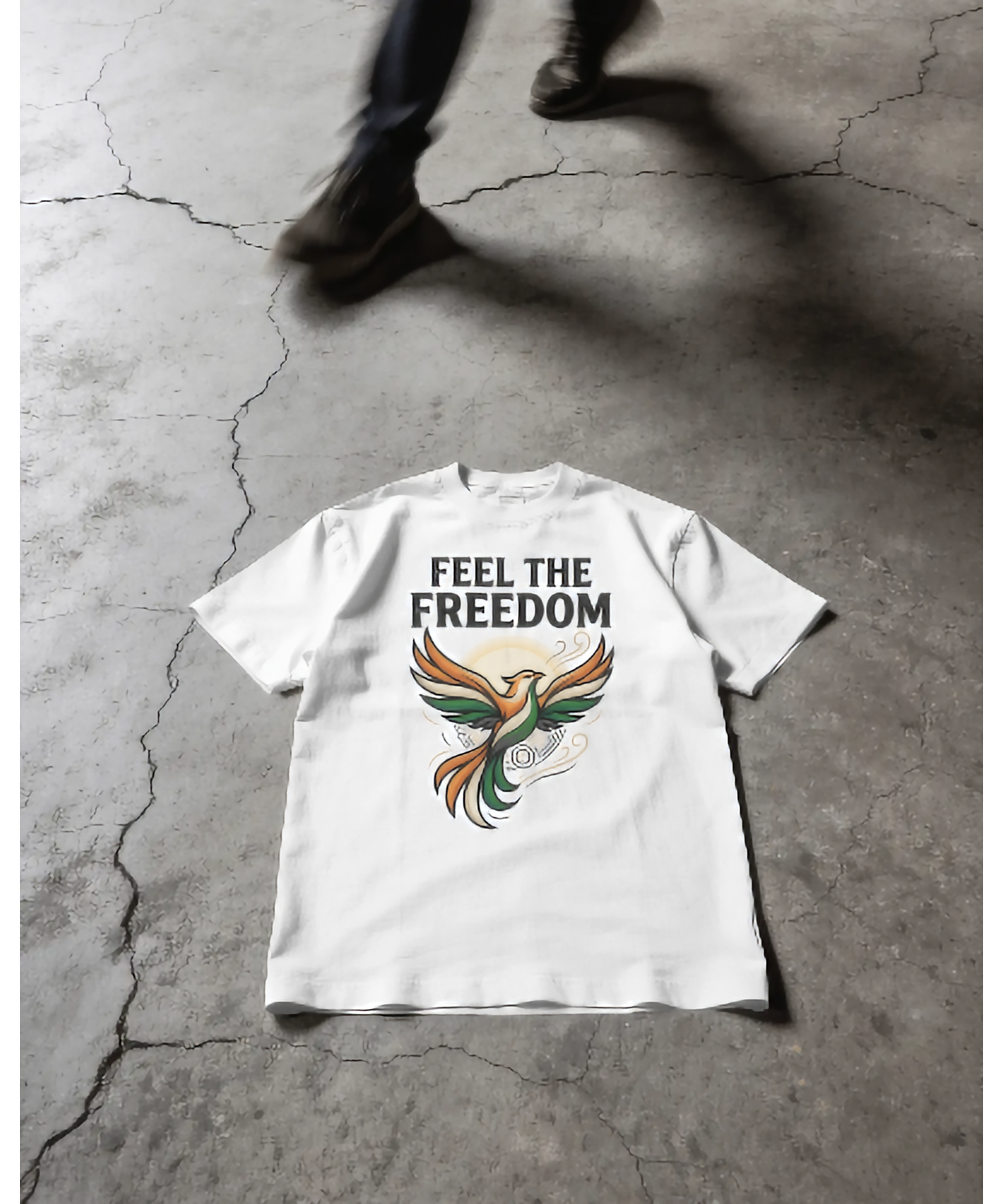 White premium unisex t-shirt by Nite Stream featuring an elegant stylized bird illustration flying upwards in Indian tricolor shades, with clean typography reading 'FEEL THE FREEDOM'.