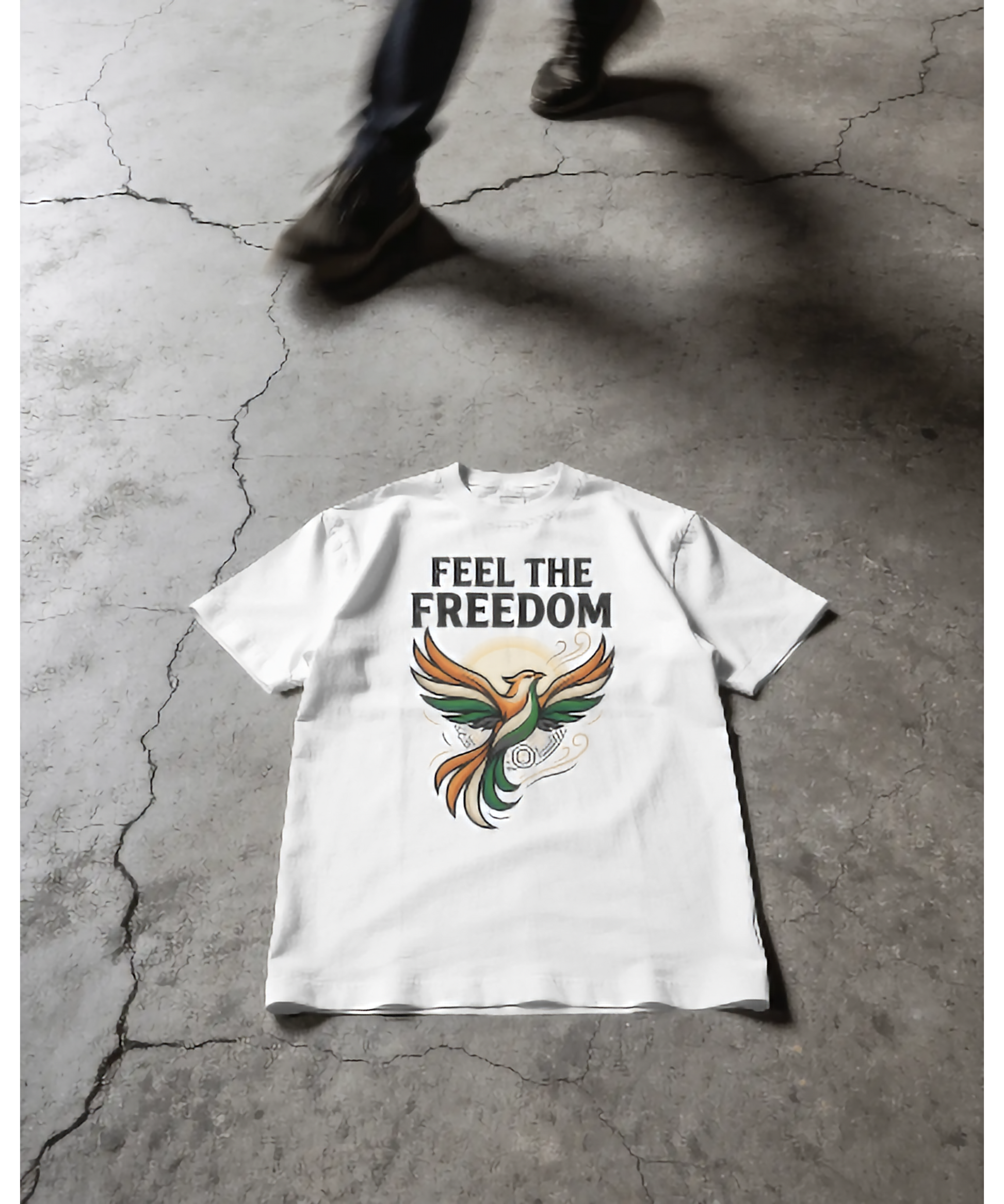 White premium unisex t-shirt by Nite Stream featuring an elegant stylized bird illustration flying upwards in Indian tricolor shades, with clean typography reading 'FEEL THE FREEDOM'.
