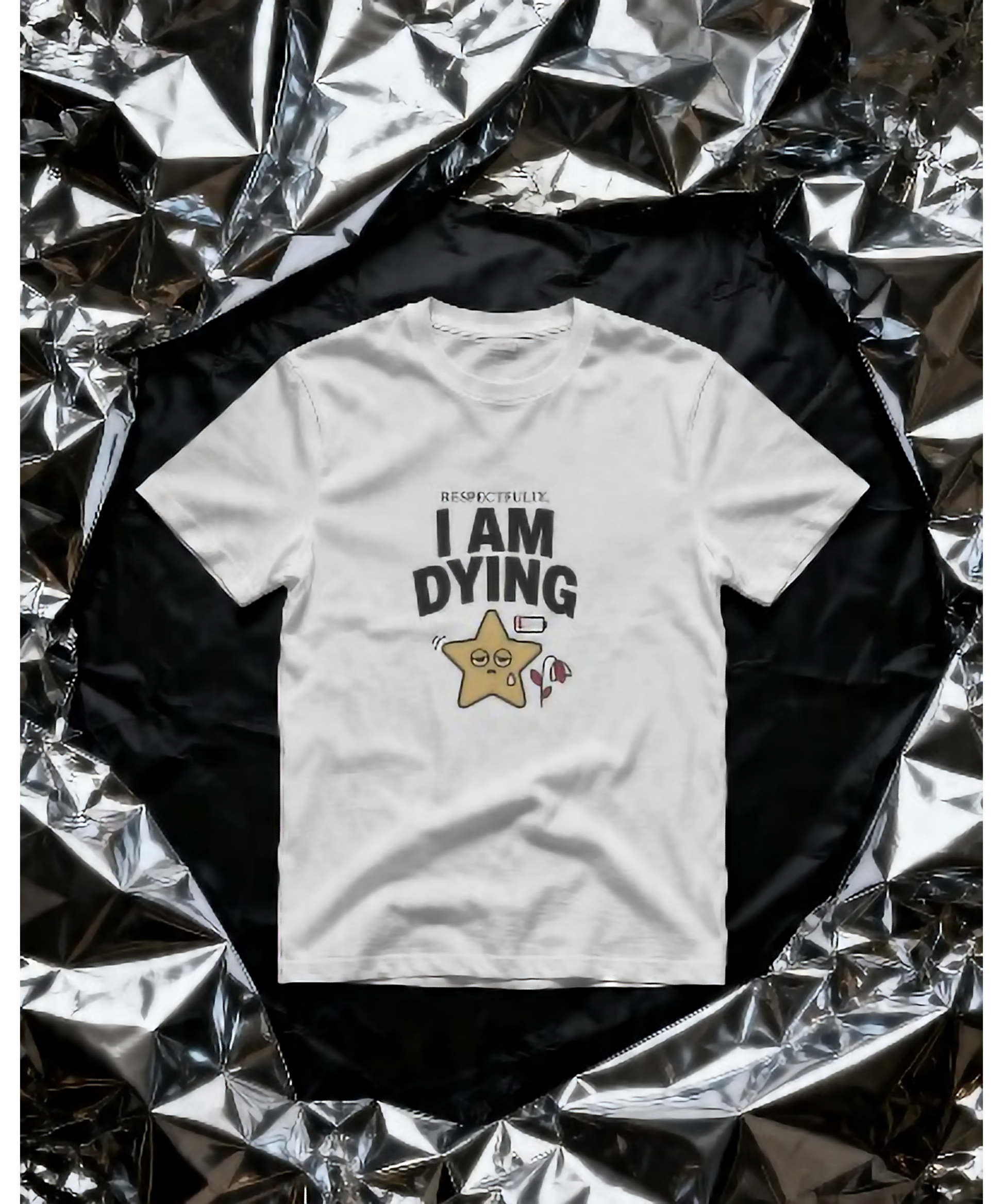 White premium unisex t-shirt by Nite Stream featuring a funny, relatable graphic of an exhausted cute star with a low battery icon, holding a drooping flower, and bold typography reading 'RESPECTFULLY, I AM DYING'.