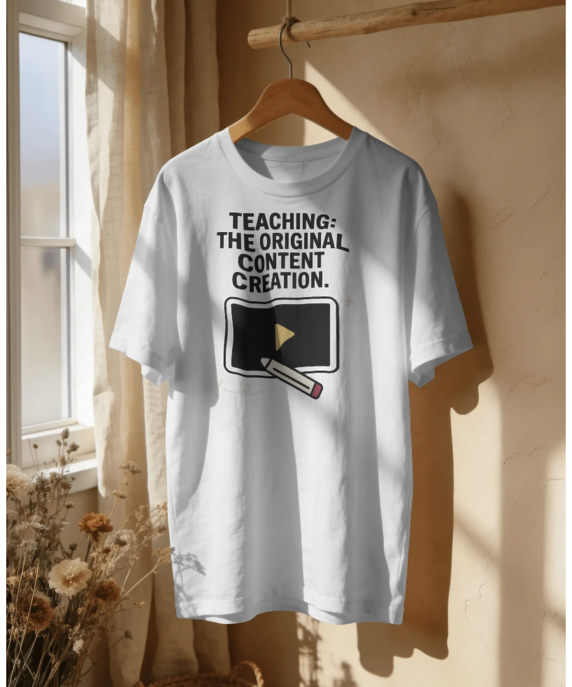 White premium unisex t-shirt by Nite Stream featuring a smart graphic of a video play button being drawn by a pencil, with bold typography reading 'TEACHING: THE ORIGINAL CONTENT CREATION.'